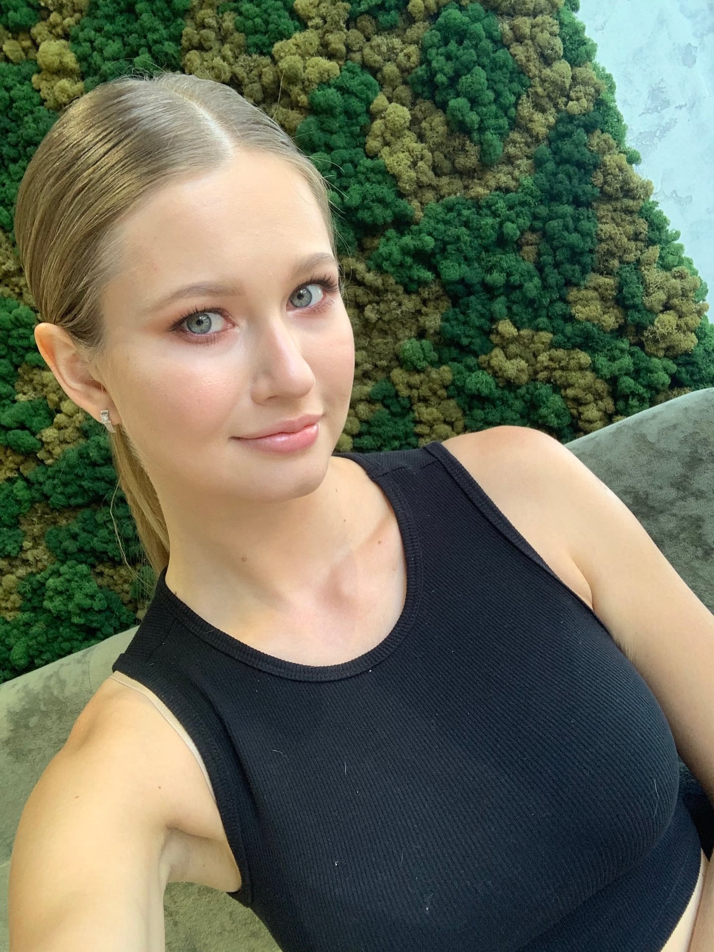 Solo girl with long blonde hair takes selfies in a variety of outfits