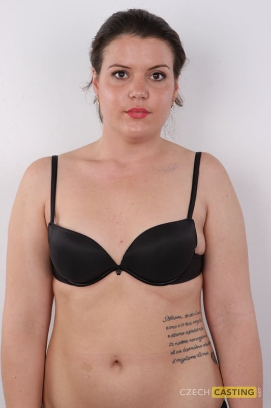 Thick amateur with a few tattoos spreads her legs after getting naked