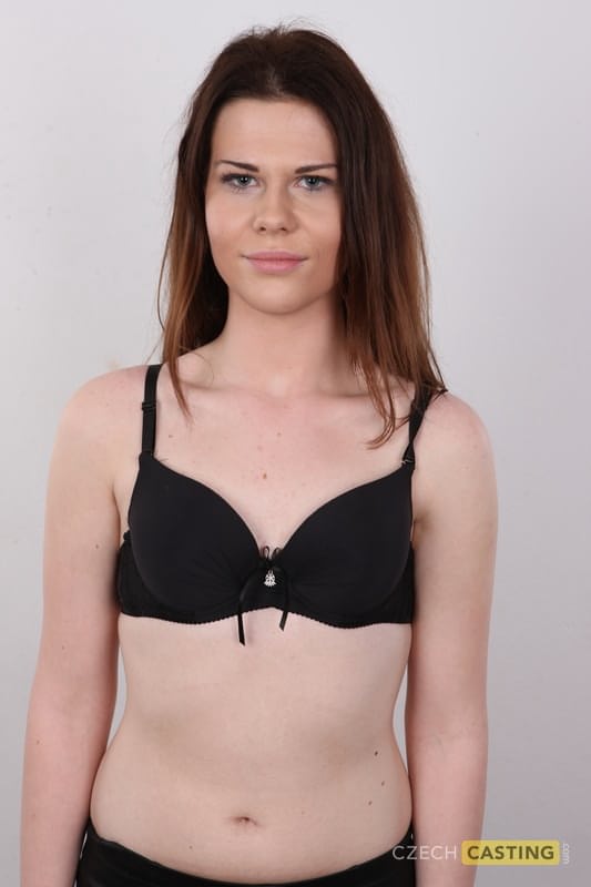 Amateur girl with reddish hair takes off all her clothes and footwear