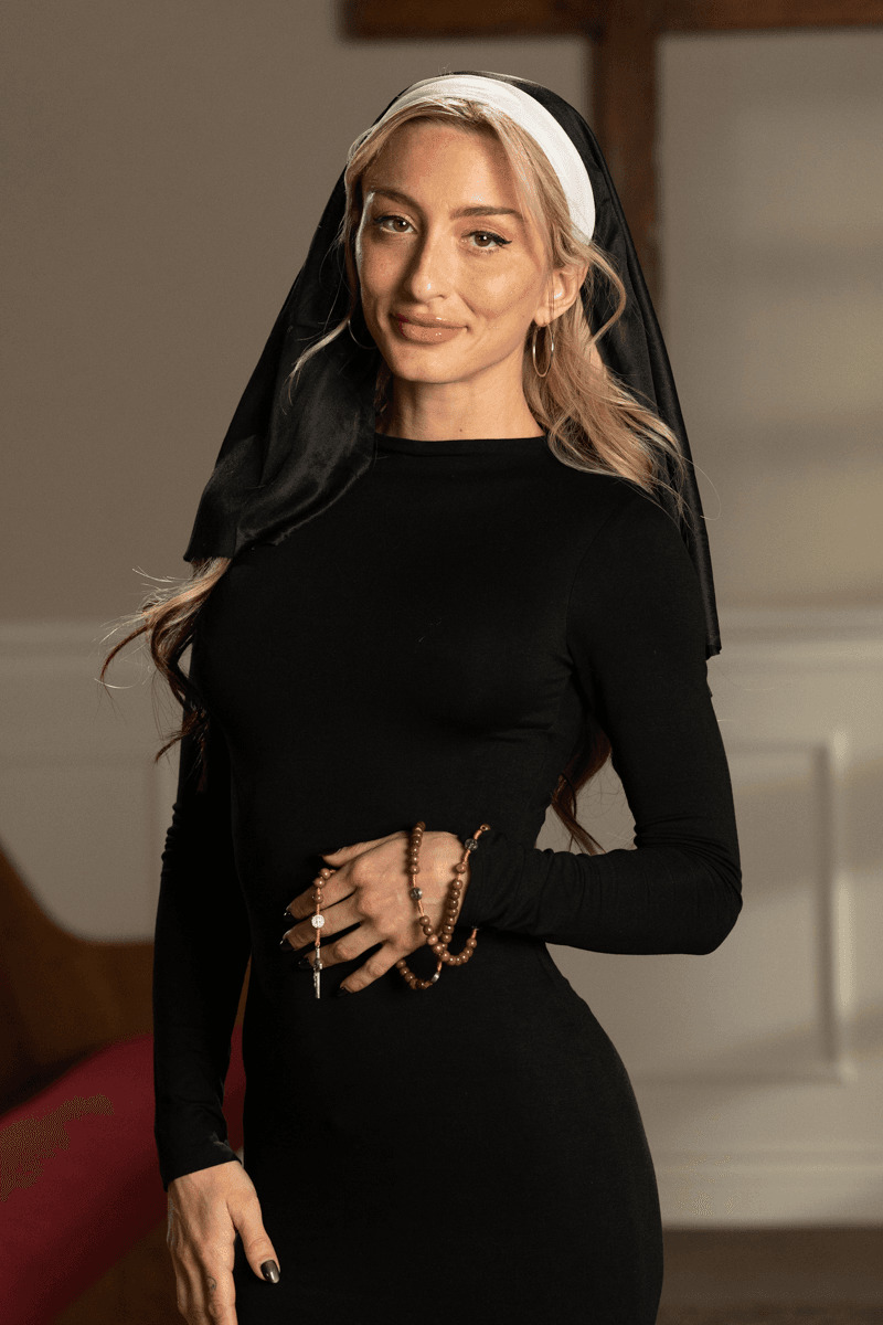 Lesbian nuns penetrate pussies with a strapon cock during kinky play