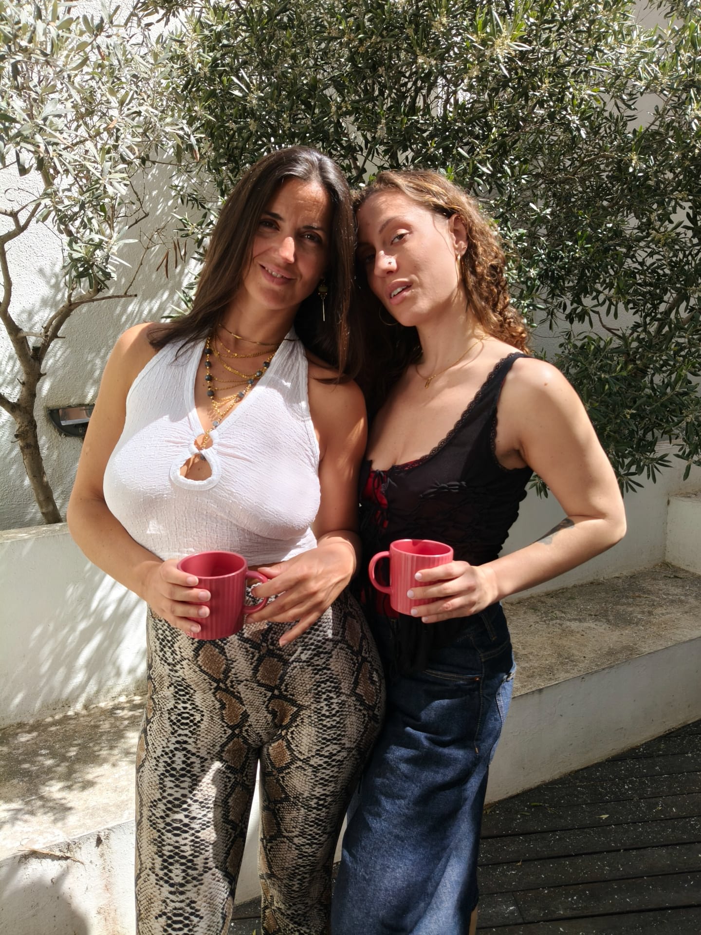 Beautiful lesbians Sofi L and Calita show off their tits and lick pussy
