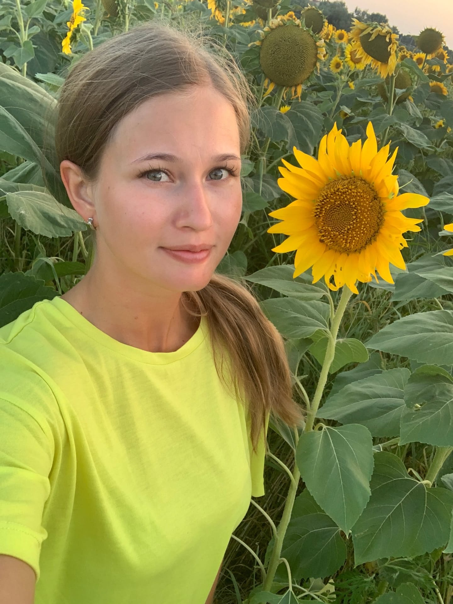 Solo girl with long blonde hair takes selfies in a variety of outfits