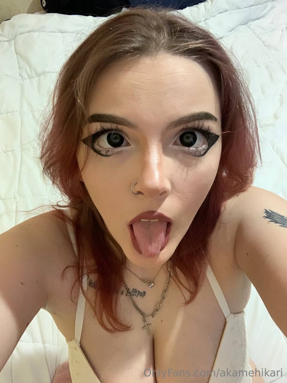 Busty amateur takes selfies while masturbating with a vibrator