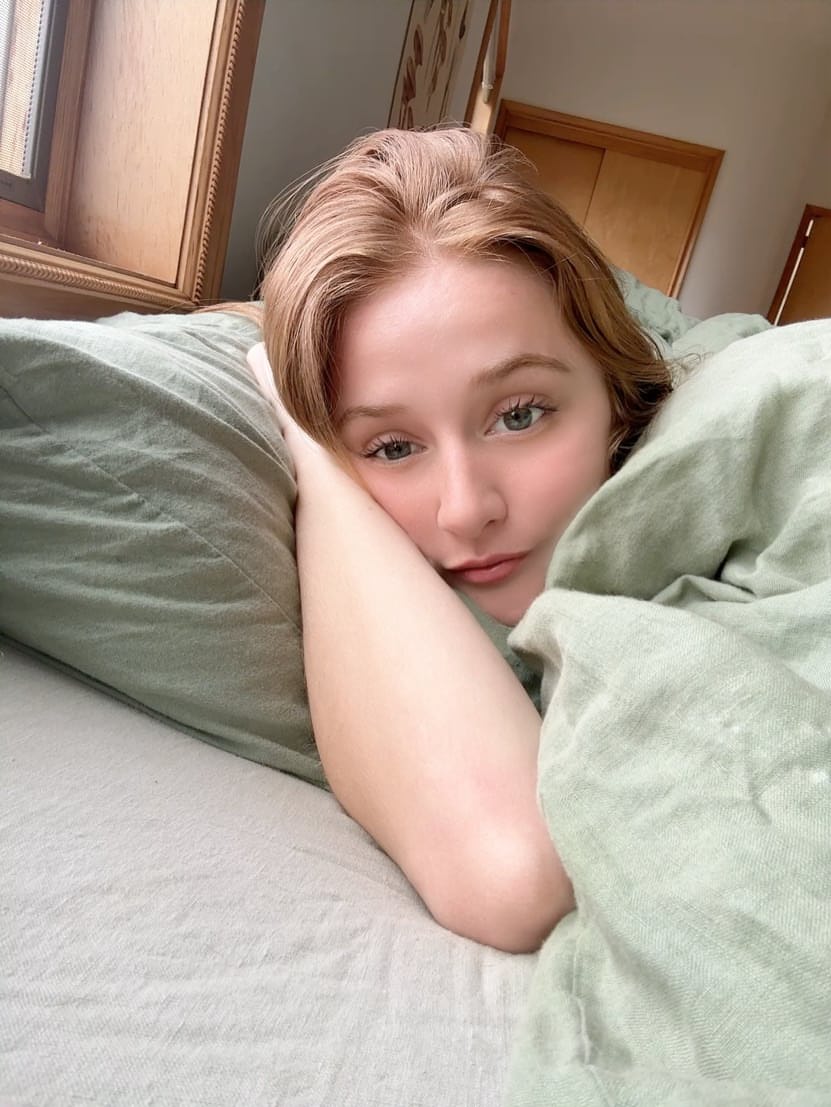 Young redhead takes selfies while exposing her tiny tits and pussy
