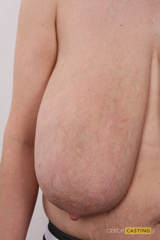 Older amateur releases her huge boobs from a lace brassiere during her nude debu