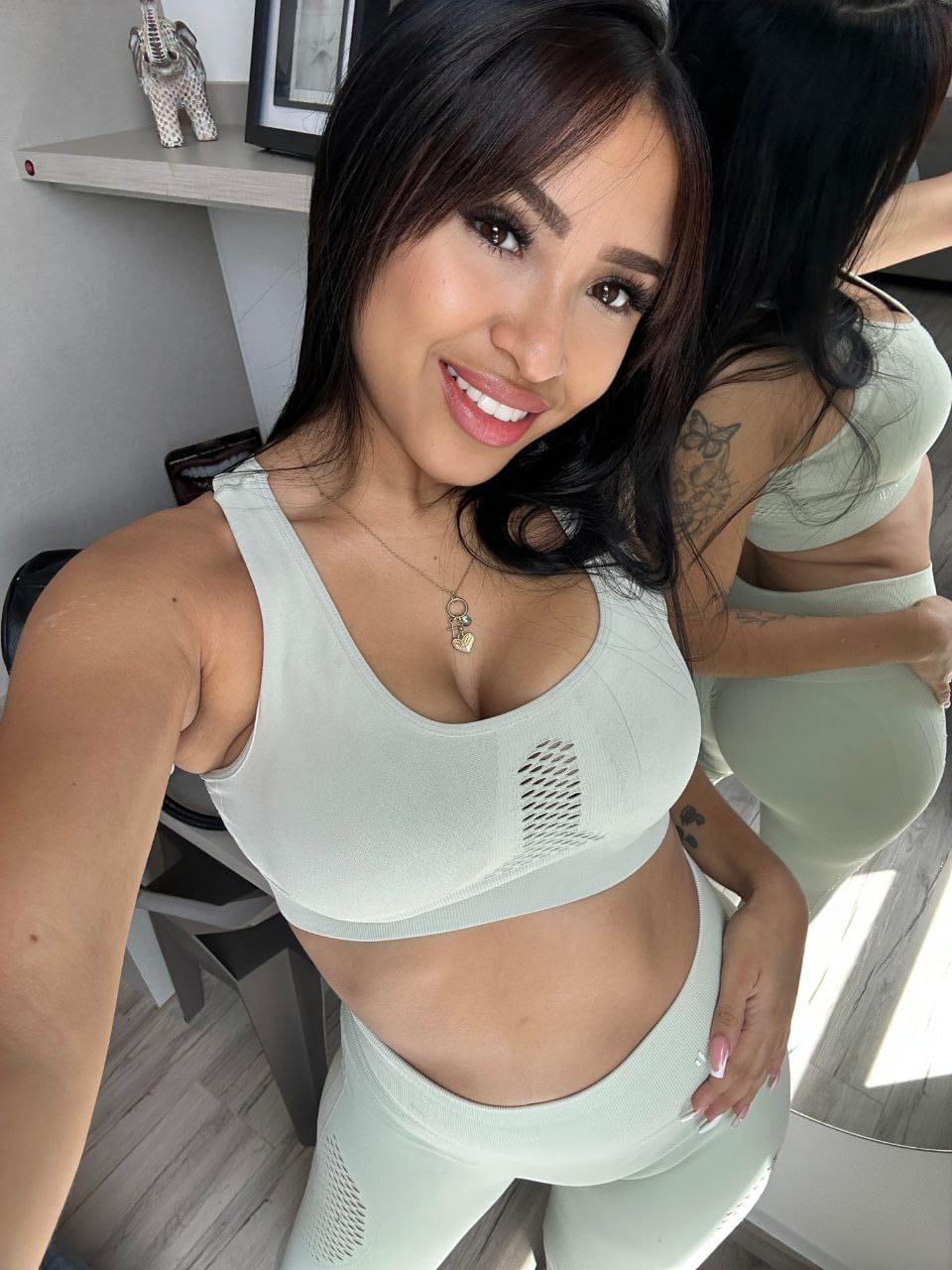 Hot Latina girl with long hair takes selfies in revealing clothing