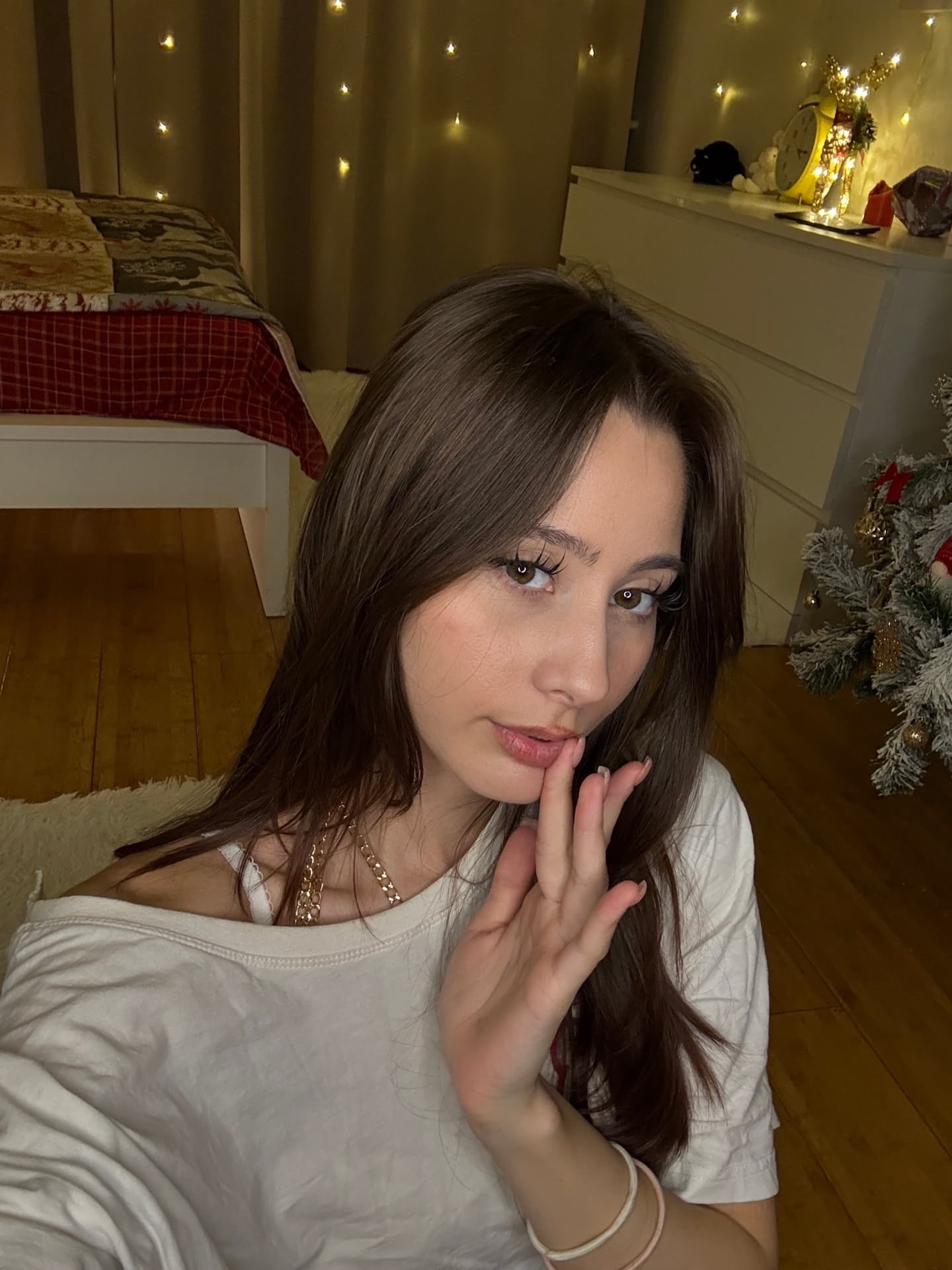 Solo girl with long hair shows off her flexibility while undressing
