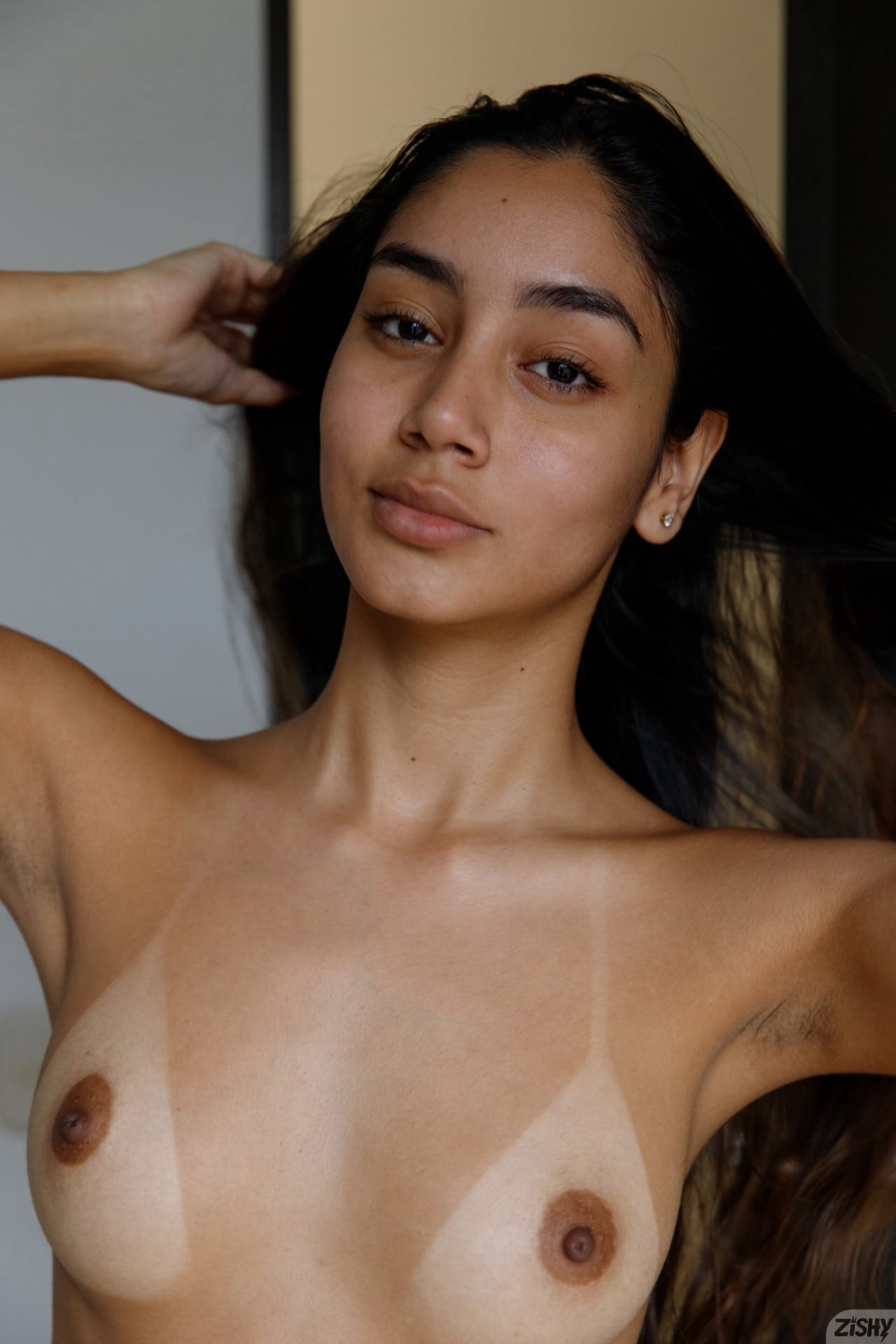 Beautiful babe Paulette Donceles shows her tanned tits and her big ass