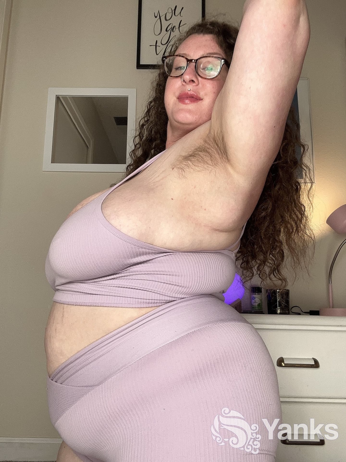 Curly haired amateur Delilah Brooke strips while showing off her chubby body