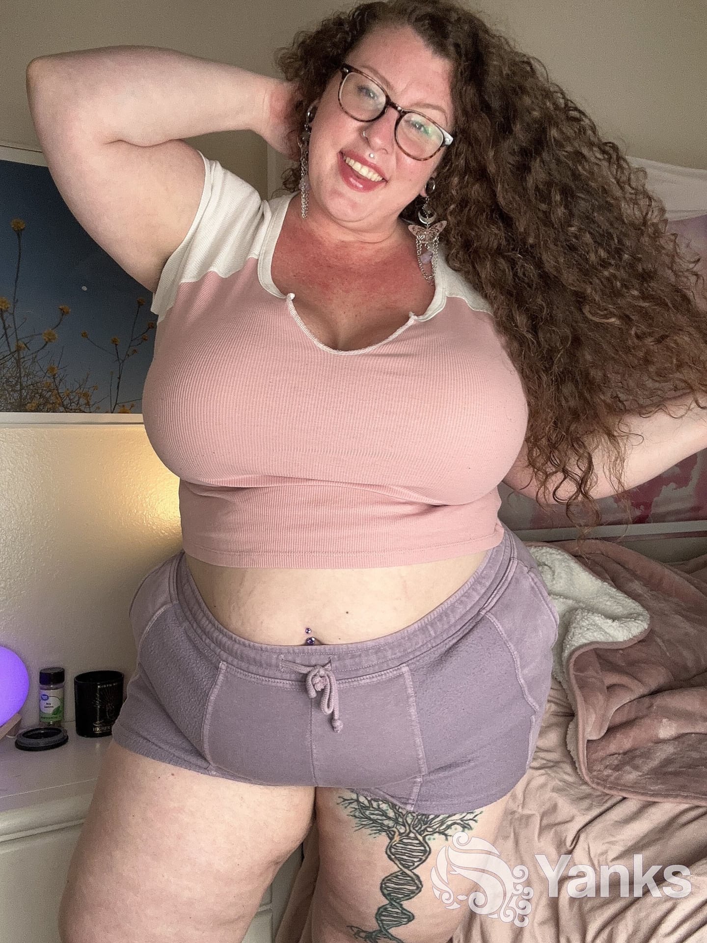 Curly haired amateur Delilah Brooke strips while showing off her chubby body
