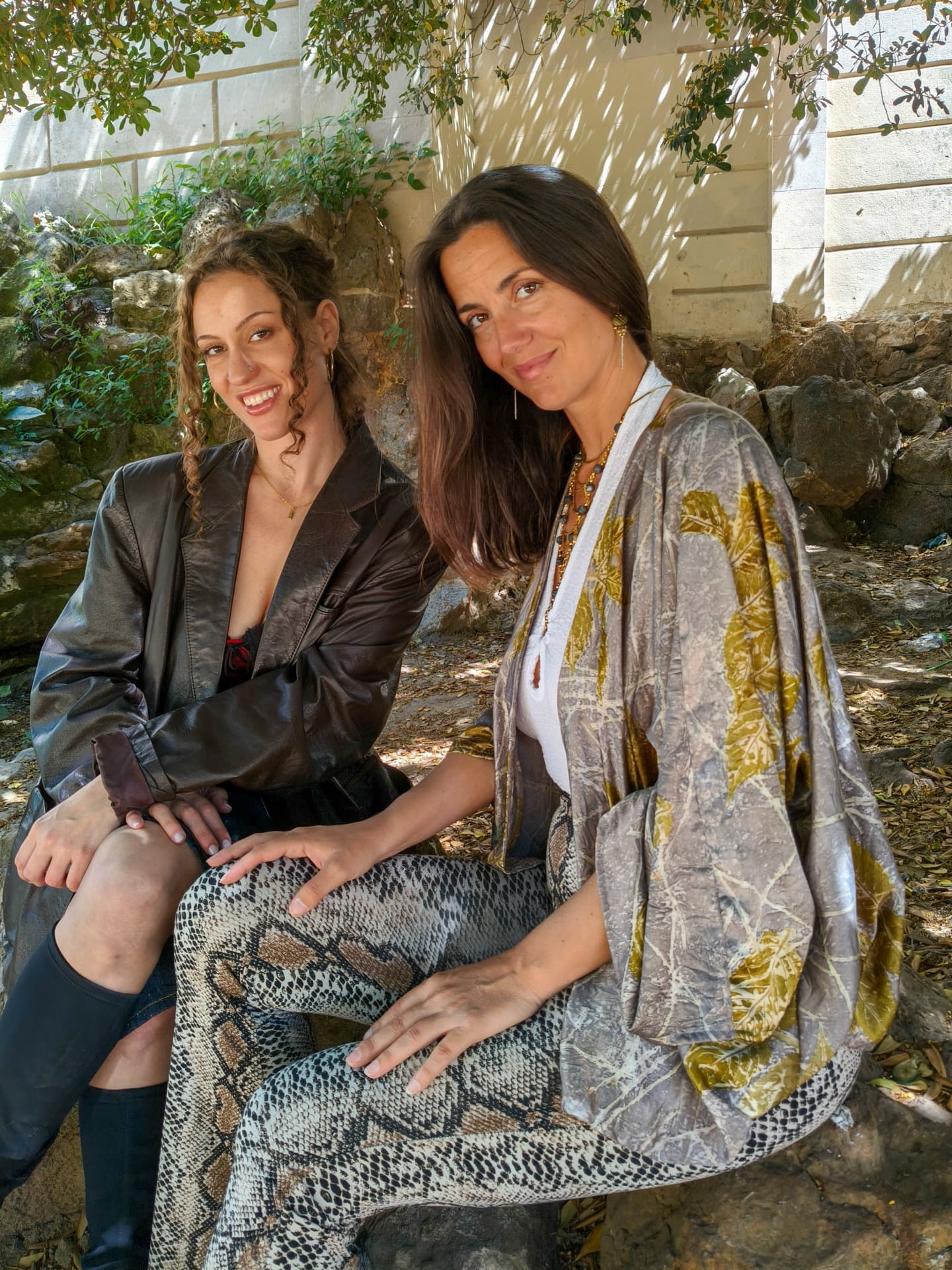 Beautiful lesbians Sofi L and Calita show off their tits and lick pussy