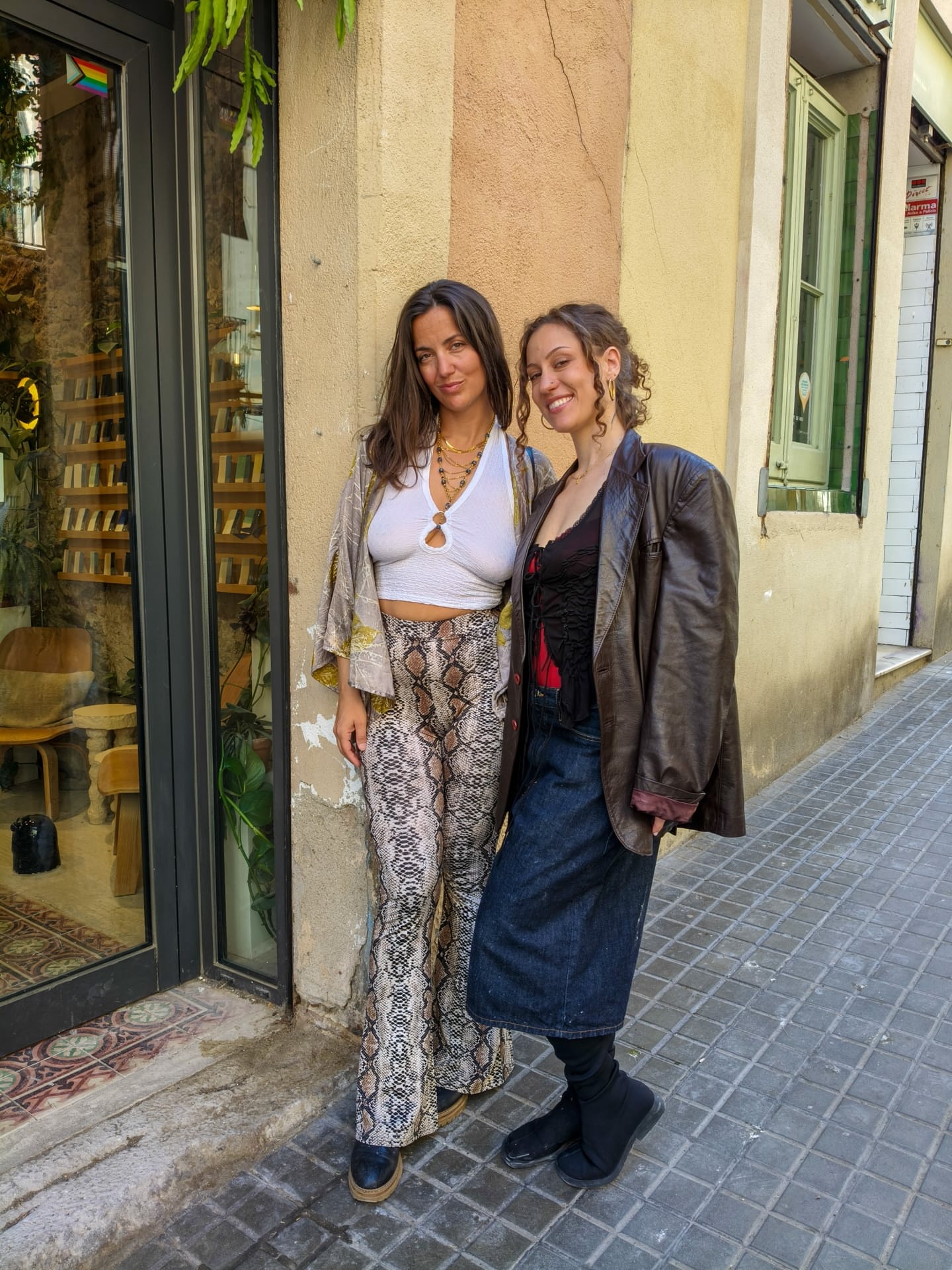 Beautiful lesbians Sofi L and Calita show off their tits and lick pussy