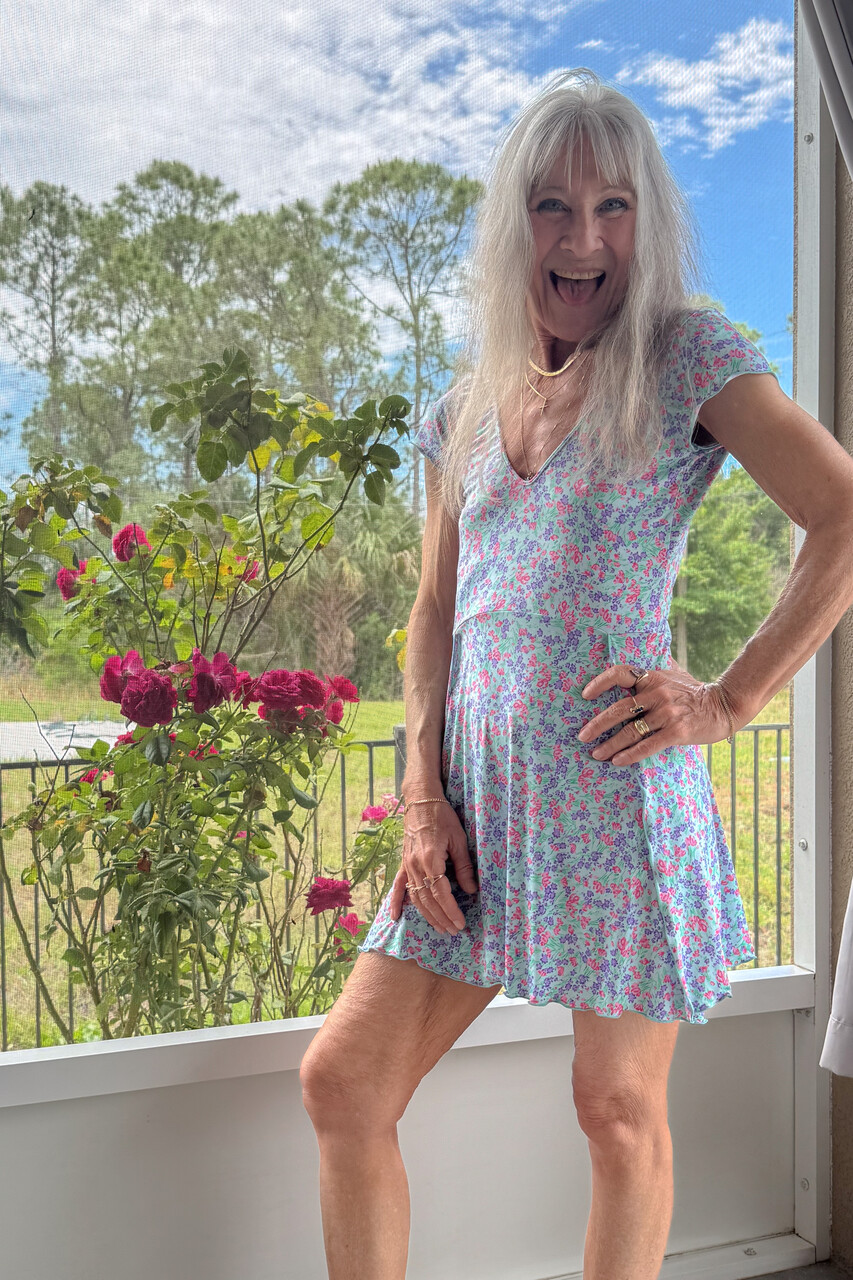 Skinny blonde granny Leilani toys her shaved pussy using a glass dildo
