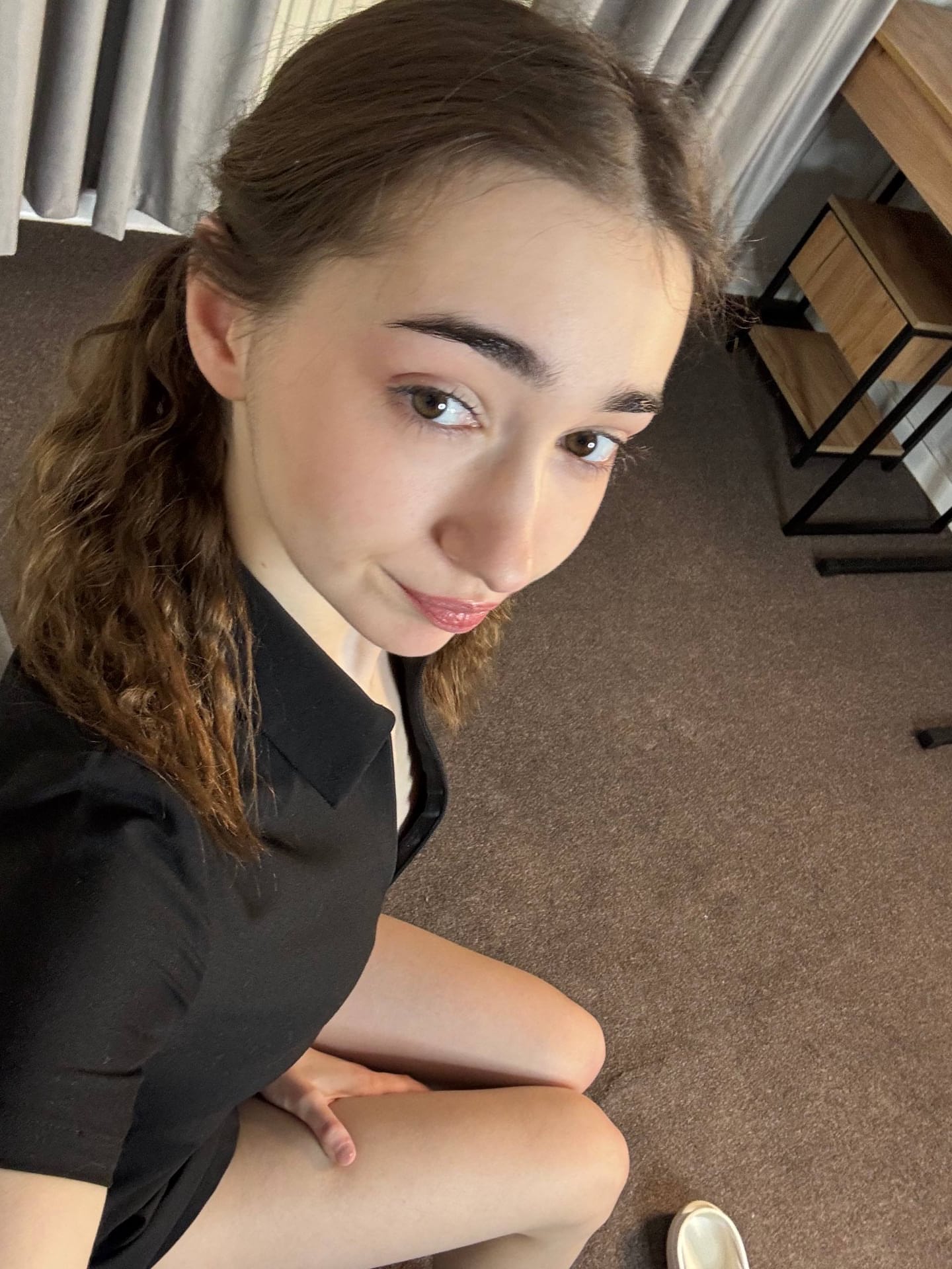 Amateur girl with glasses and long hair takes selfies in revealing outfits