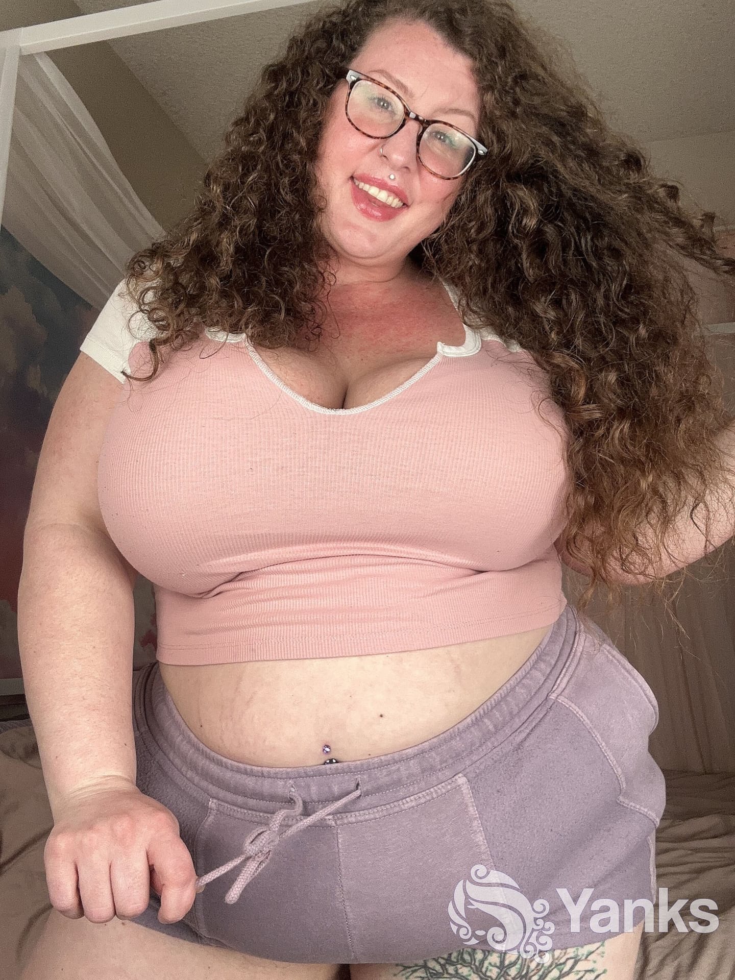 Curly haired amateur Delilah Brooke strips while showing off her chubby body