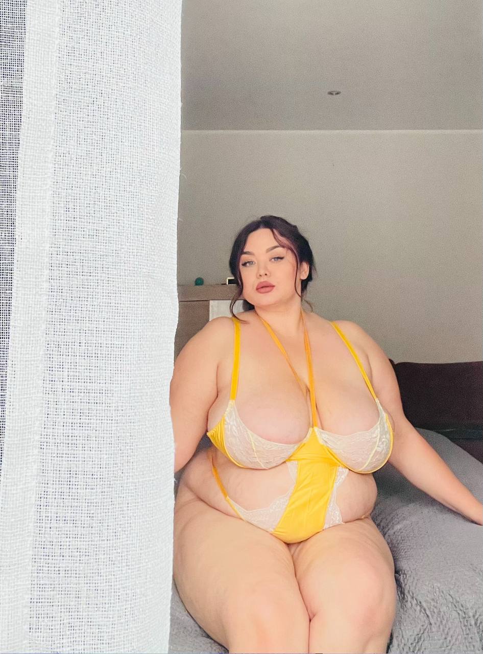 Solo girl takes selfies while wearing revealing lingerie and hosiery