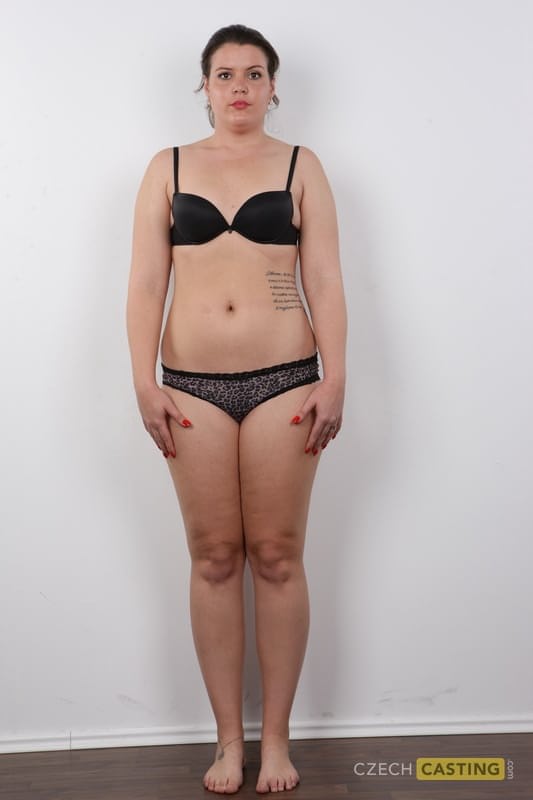 Thick amateur with a few tattoos spreads her legs after getting naked