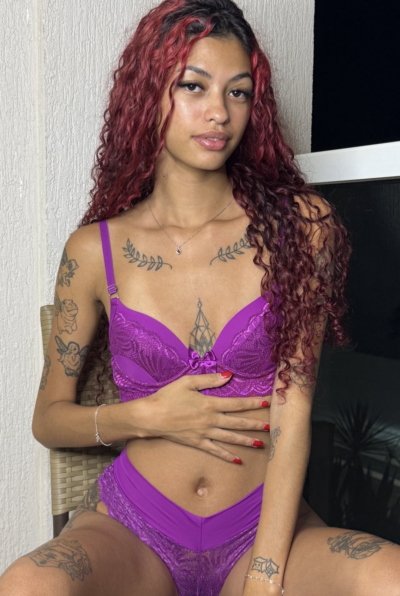 Tattooed redhead works free of sexy lingerie during solo action