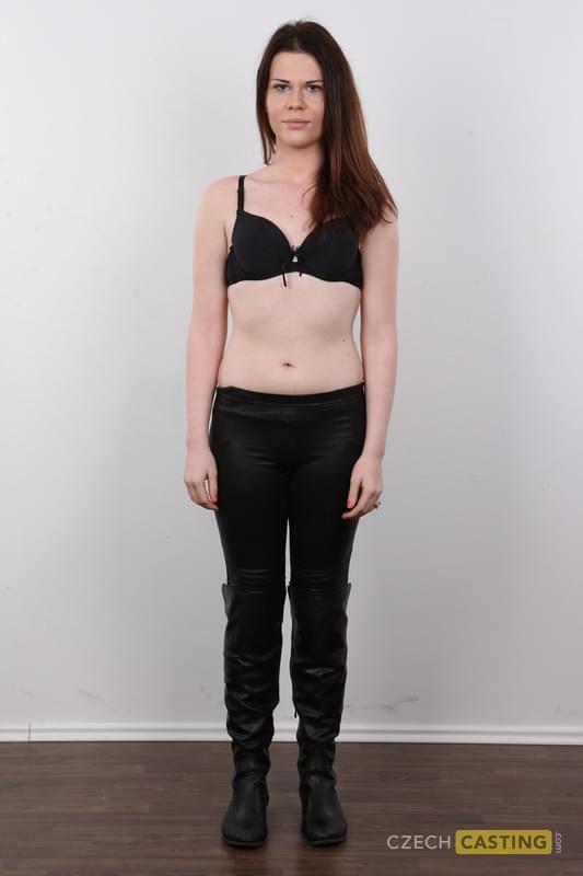 Amateur girl with reddish hair takes off all her clothes and footwear