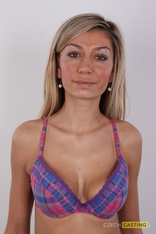 Blonde amateur removes her clothing to make her nude modeling debut