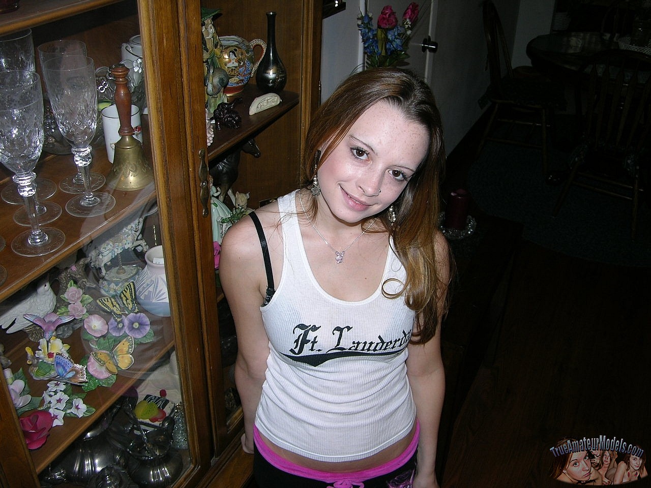 Redheaded college girl holds a spent cock after sexual intercourse