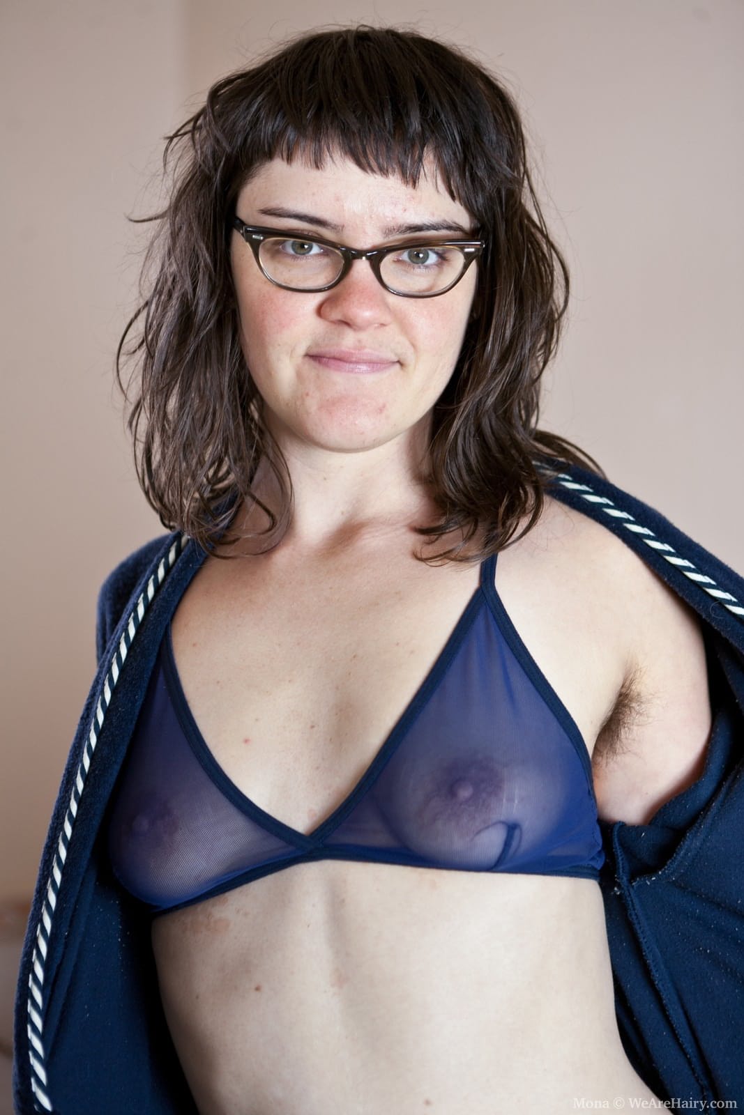 Dark haired girl takes off a bathrobe and sheer lingerie to go nude in a tub
