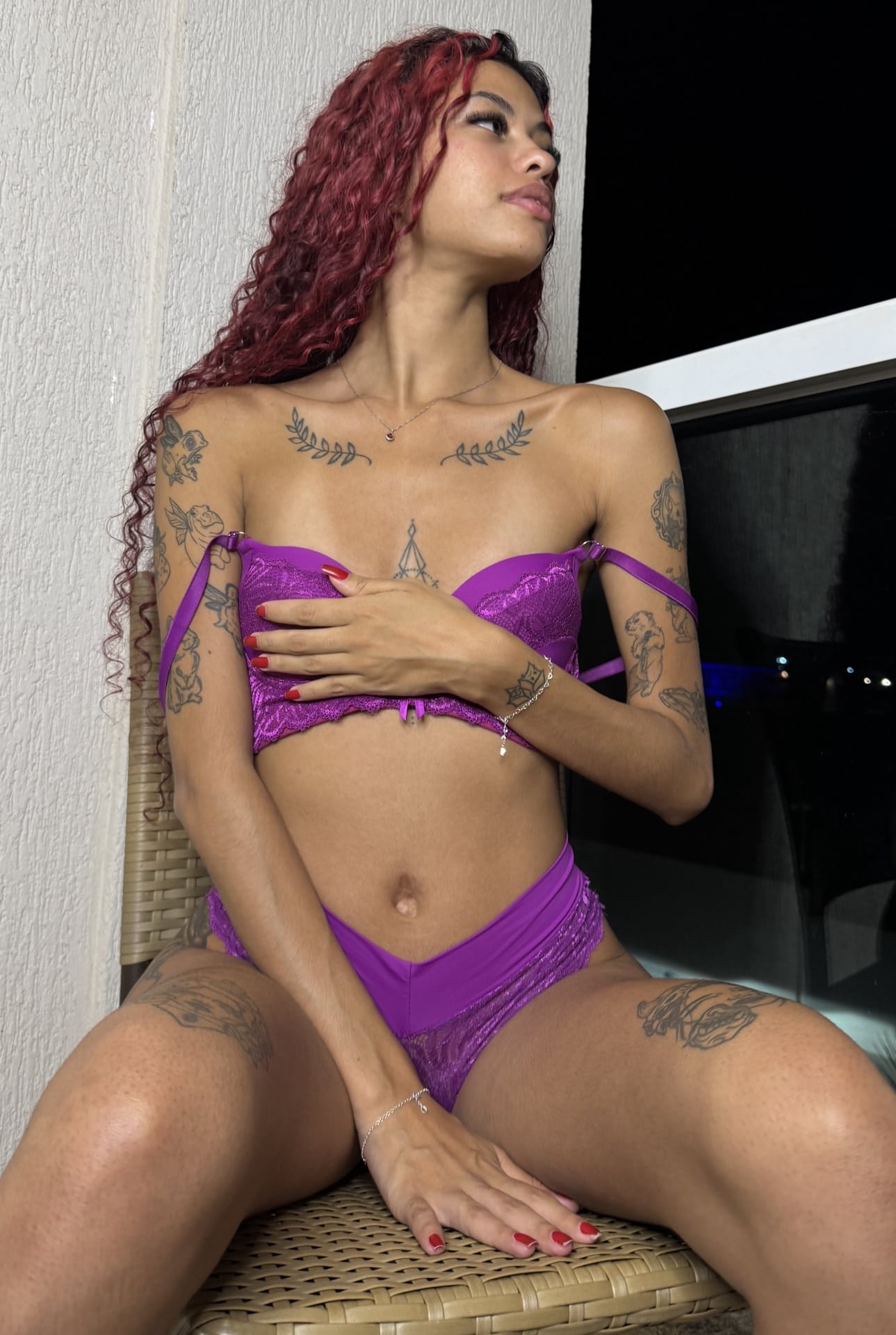 Tattooed redhead works free of sexy lingerie during solo action