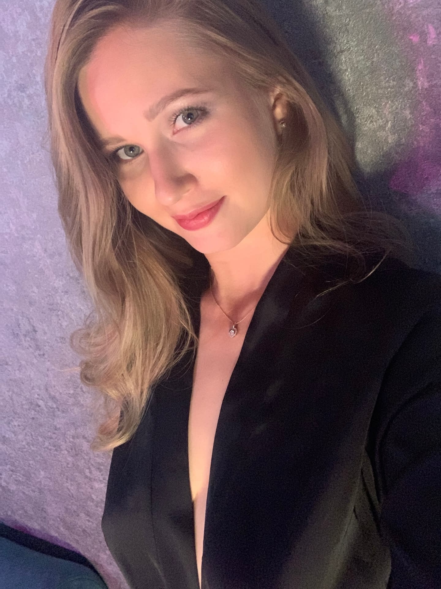 Solo girl with long blonde hair takes selfies in a variety of outfits