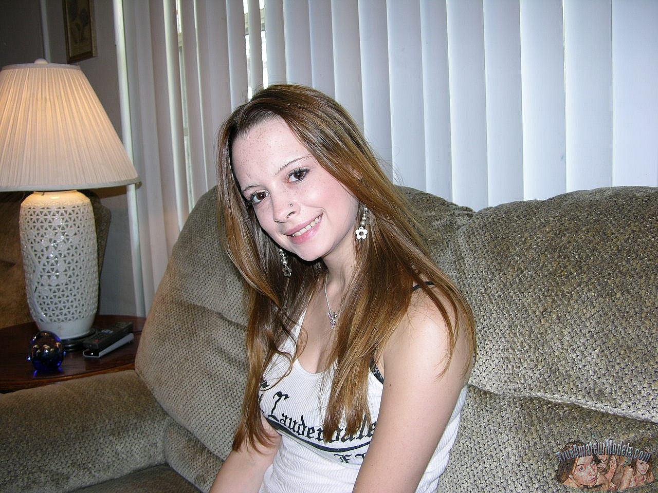 Redheaded college girl holds a spent cock after sexual intercourse