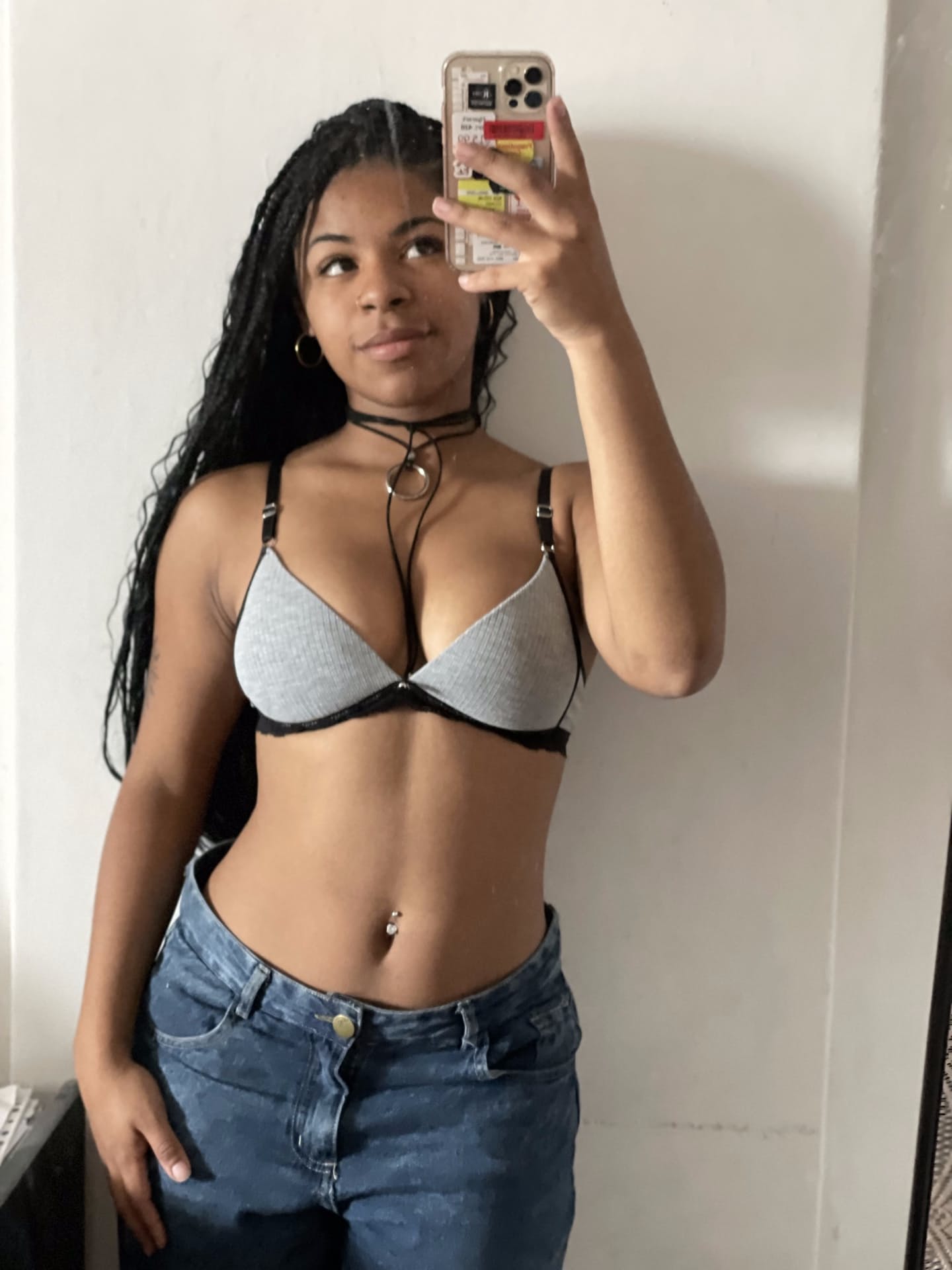 Ebony solo girl with a full head of curly hair models a lot of outfits