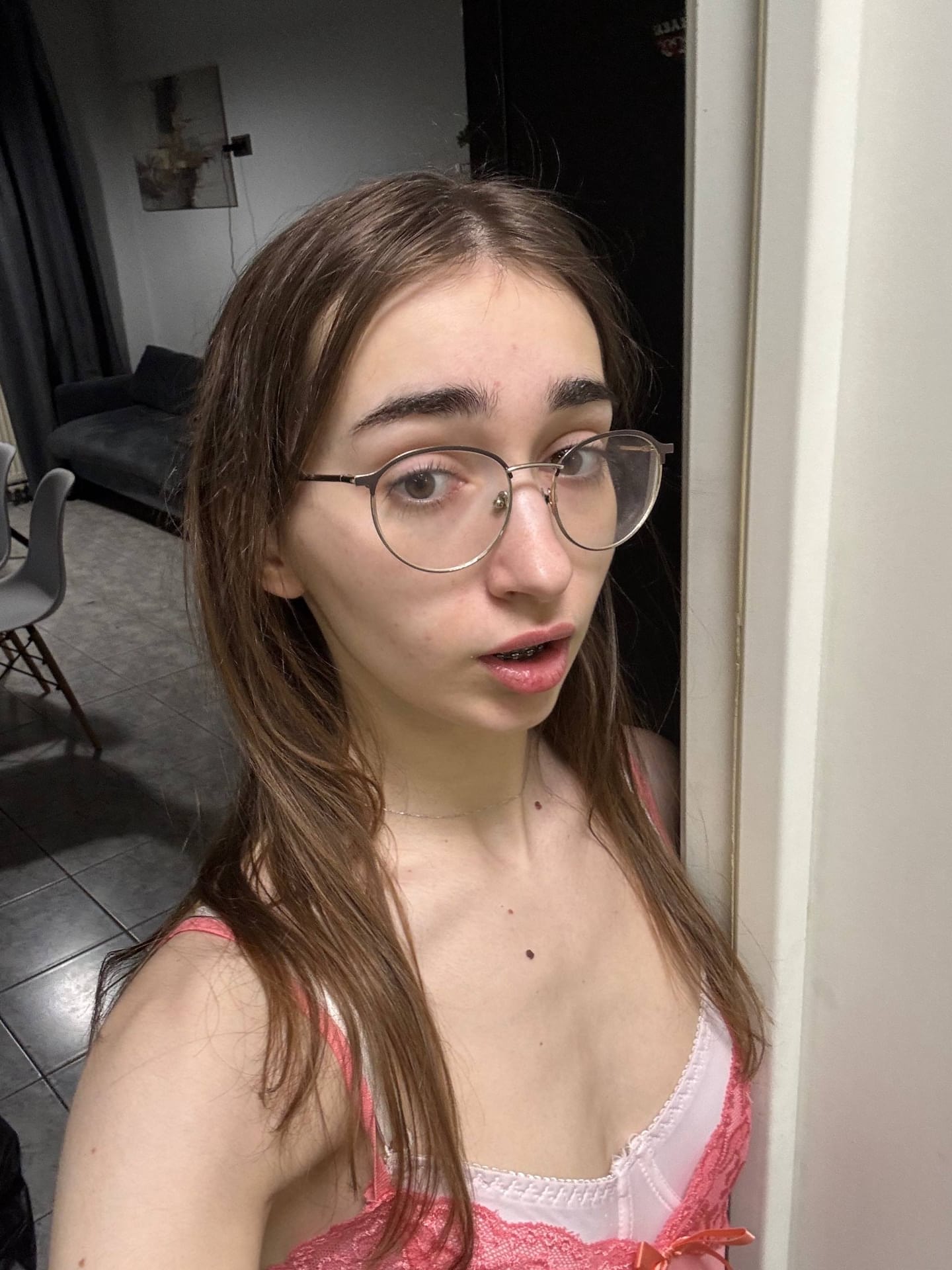 Glasses clad teen strikes great solo poses while mostly clothed