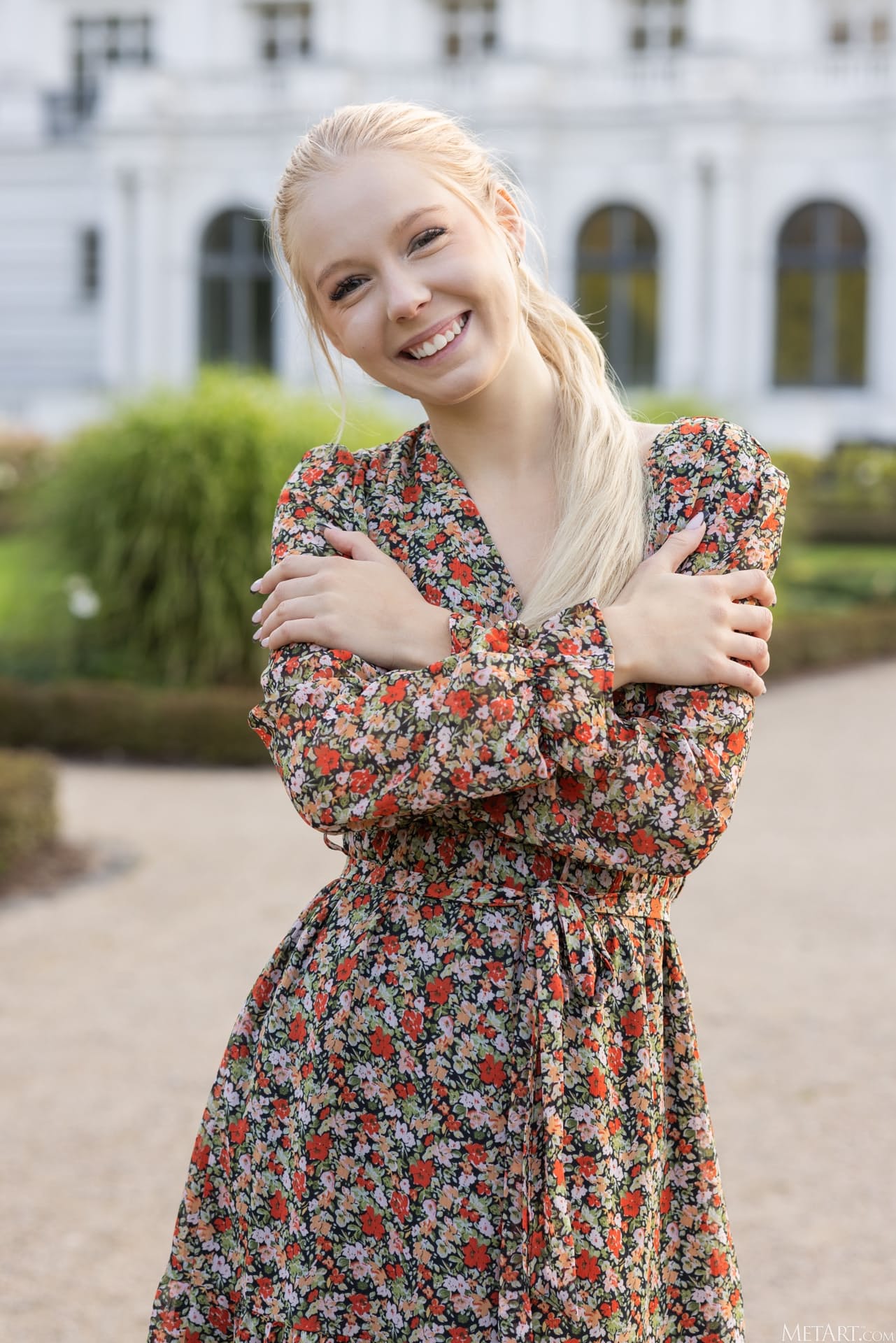 Cute blonde teen shows her natural tits and tight pink slit in a garden