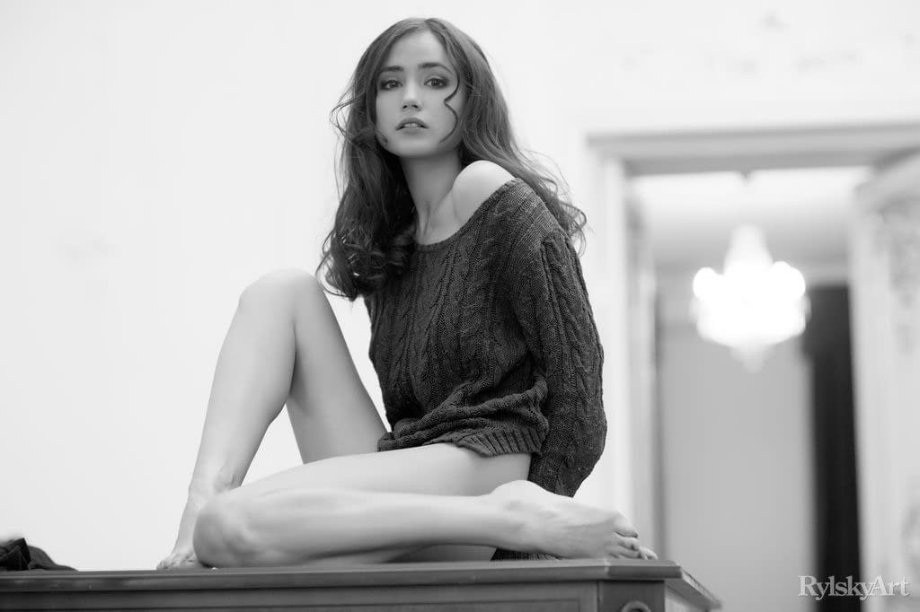 Solo model Cecile puts her great body on display in a chandelier lit room