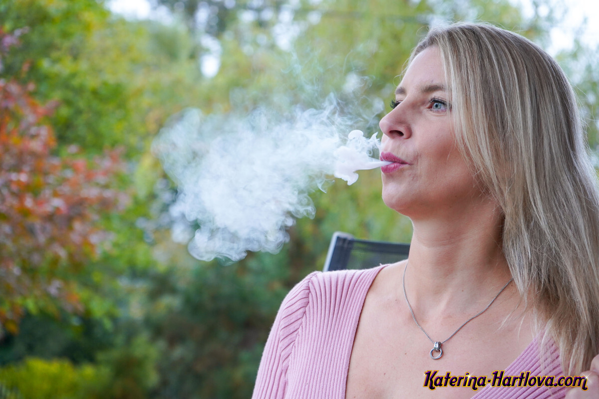 Busty blonde Katerina Hartlova smokes a vape pen while playing with her pussy