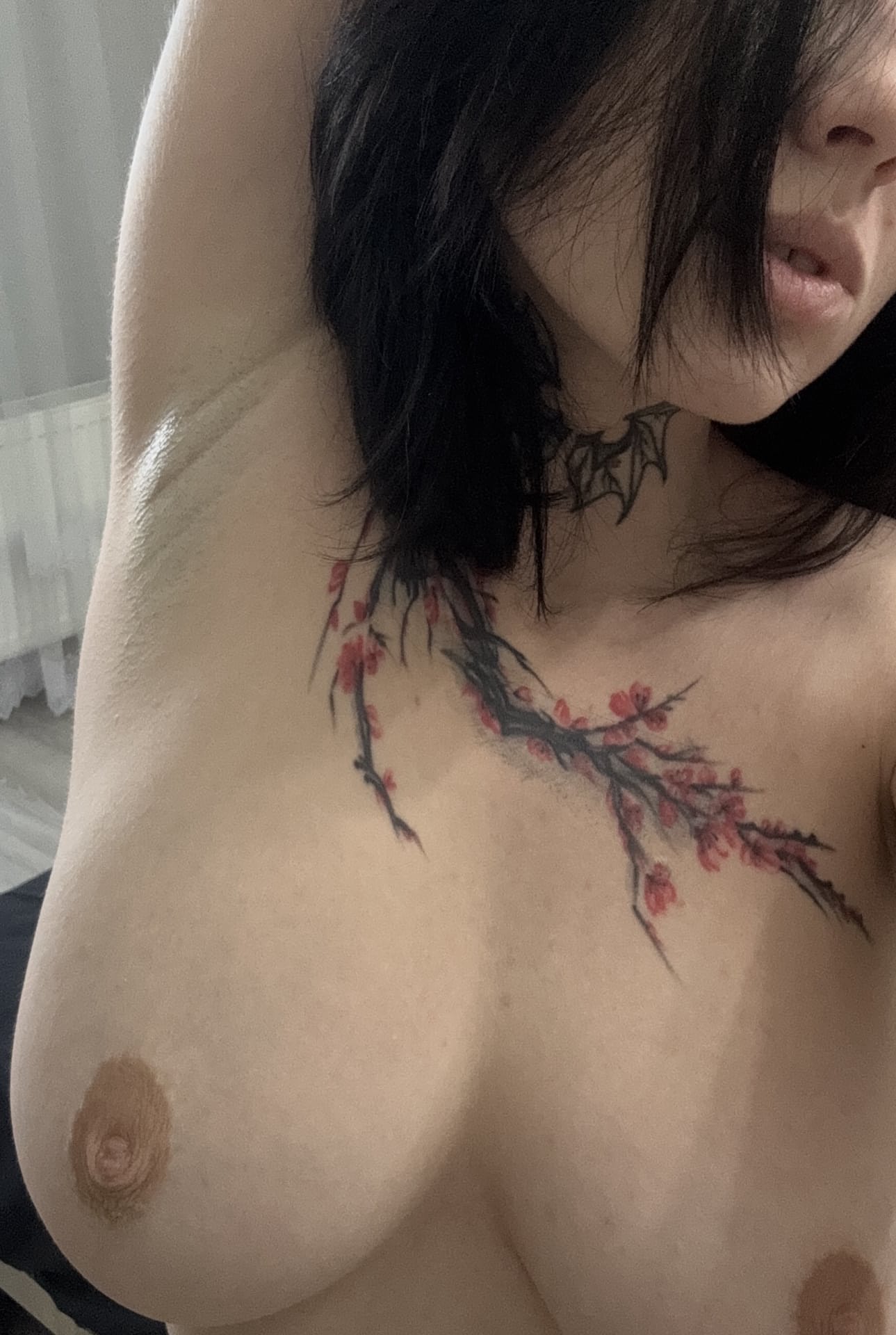 Tattooed teen with a huge knockers takes selfies during a solo shoot