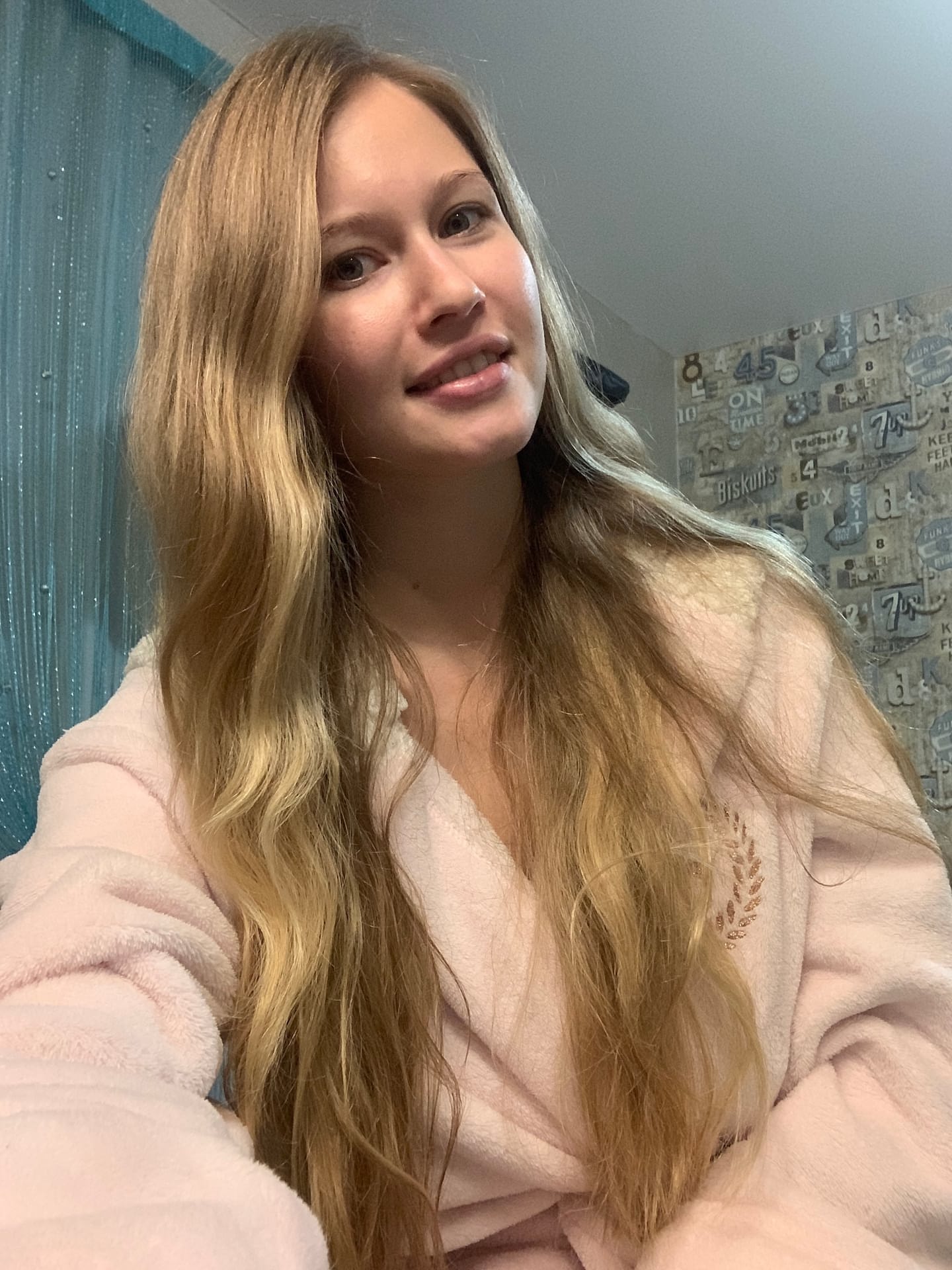 Solo girl with long blonde hair takes selfies in a variety of outfits