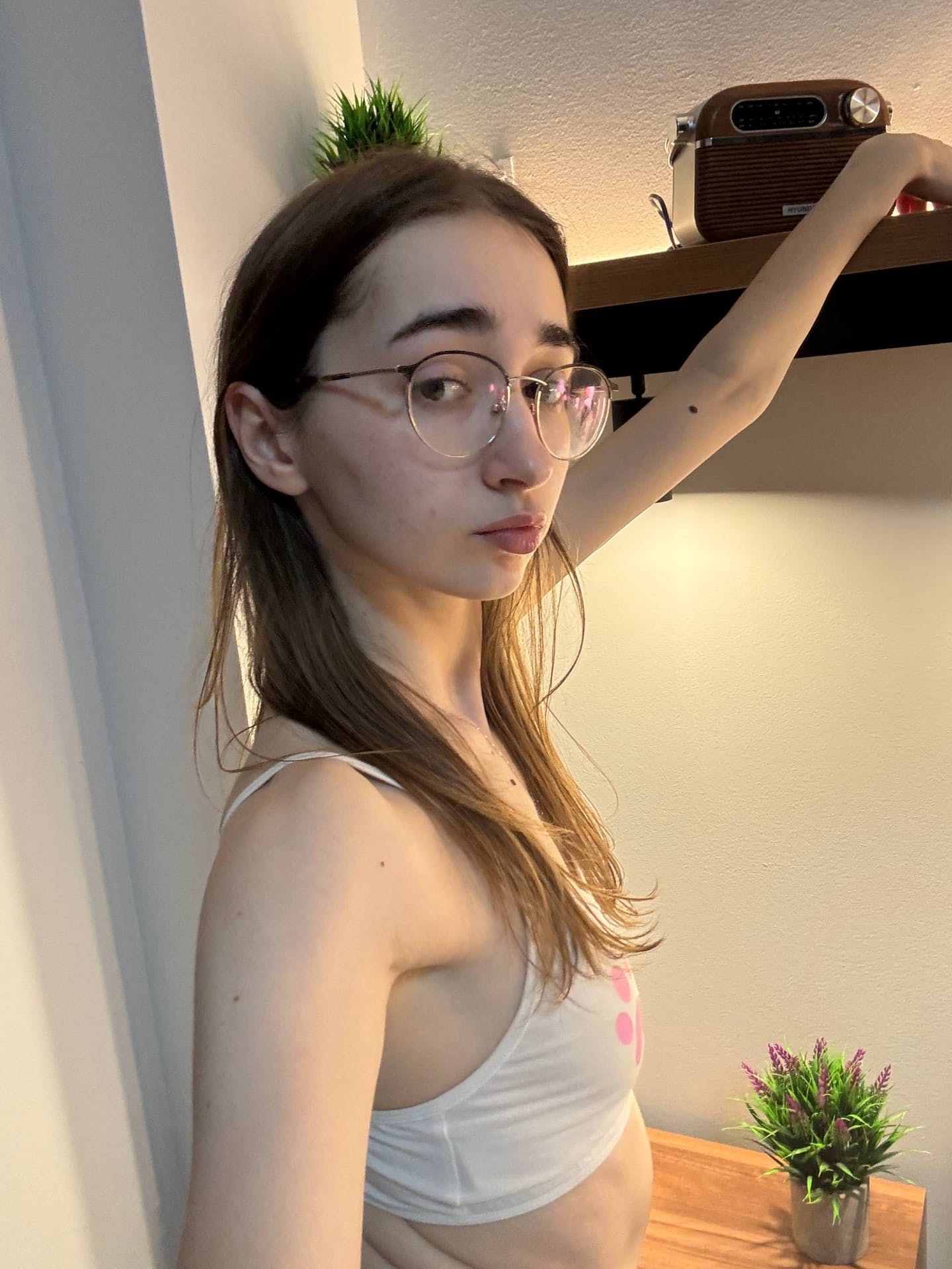 Glasses clad teen strikes great solo poses while mostly clothed