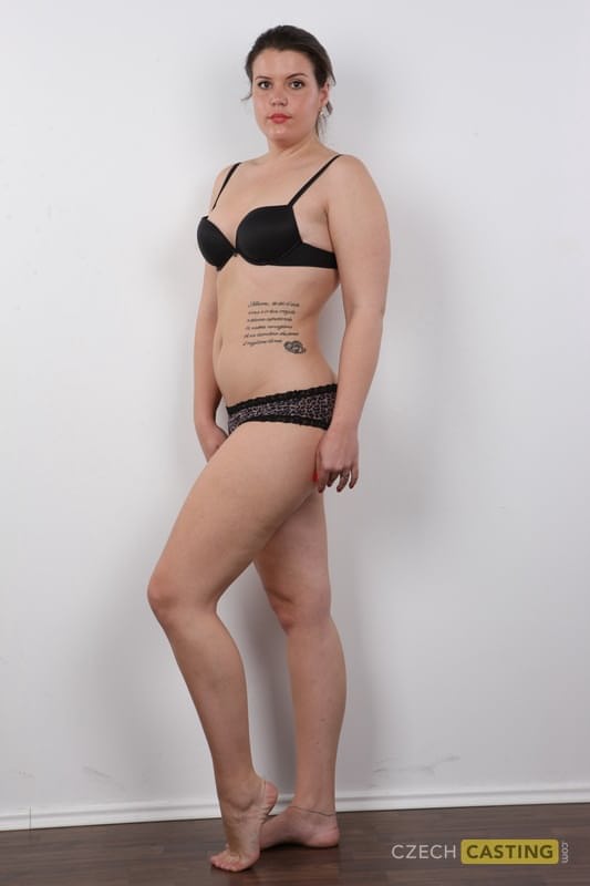 Thick amateur with a few tattoos spreads her legs after getting naked