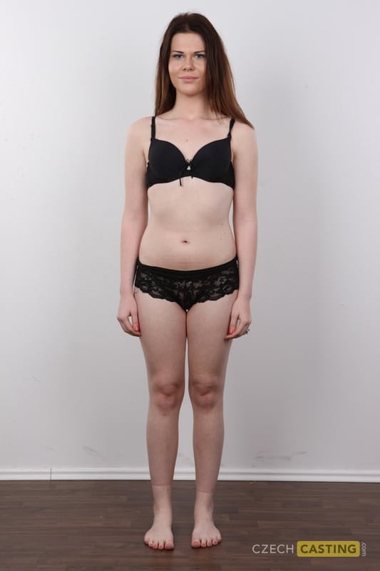 Amateur girl with reddish hair takes off all her clothes and footwear