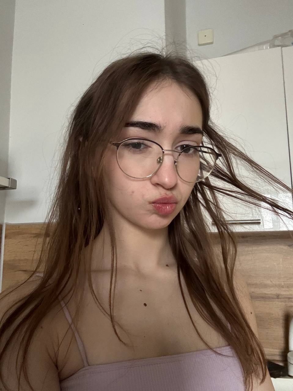 Glasses clad teen strikes great solo poses while mostly clothed