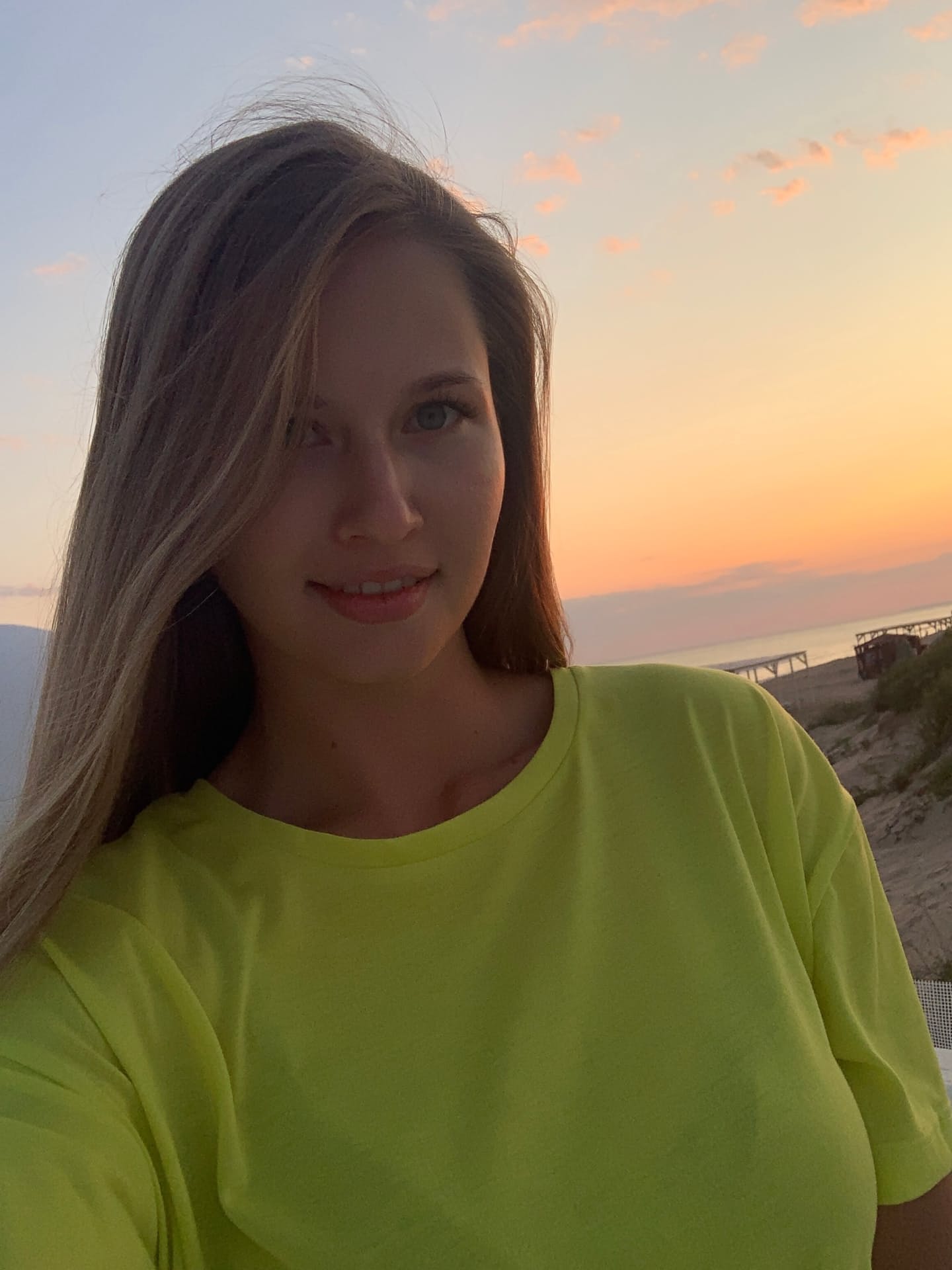 Solo girl with long blonde hair takes selfies in a variety of outfits