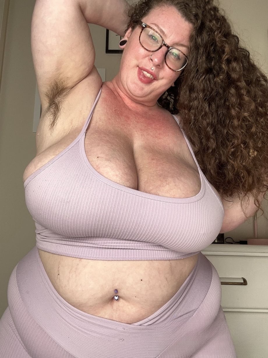 Curly haired amateur Delilah Brooke strips while showing off her chubby body